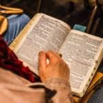 Revived citizen holding bible